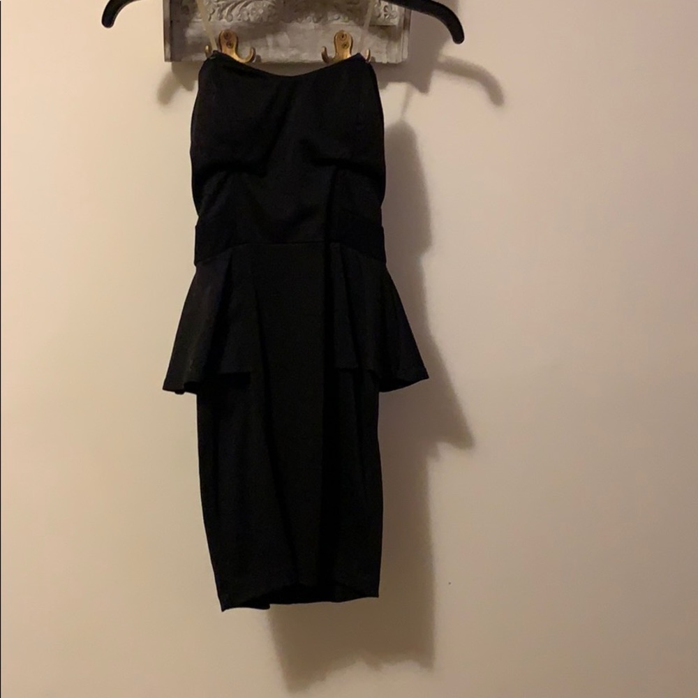 Mini black strapless peplum dress